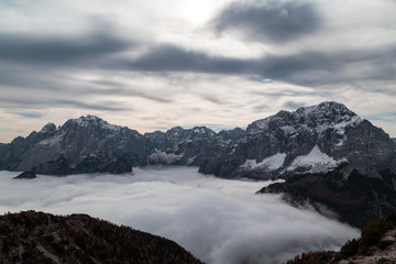 Fototapeta na wymiar Cloudy autumn day in the italian alps