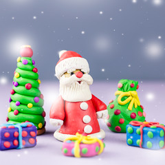 Merry Christmas greeting card with decorations. Santa Claus, Christmas tree and presents with snow falling
