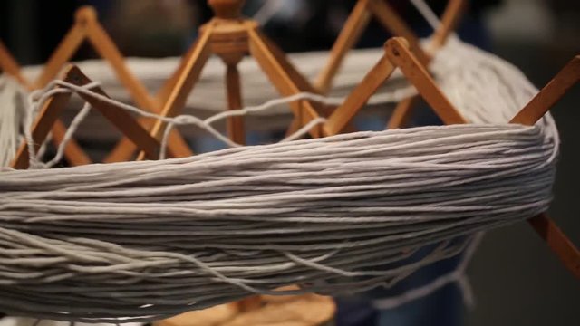 ancient wooden spinning wheel turns 