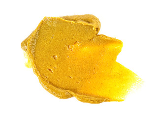 Mustard sauce. Splash of mustard on a white background.
