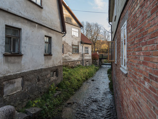 Fototapeta na wymiar River between houses in old town.