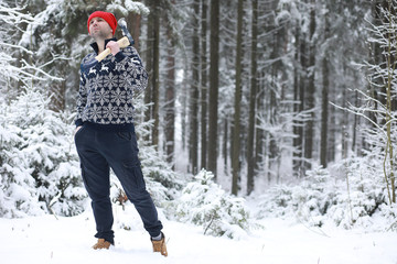 A man in the woods. Young man went to the logging.