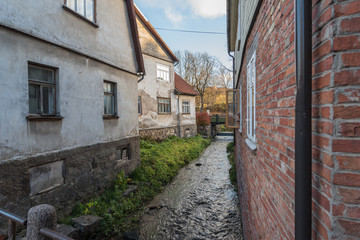 Fototapeta na wymiar River between houses in old town.