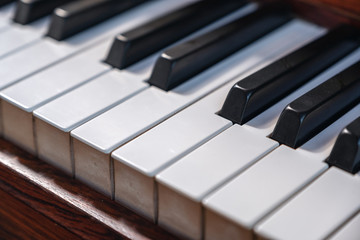 Obraz na płótnie Canvas Closeup image of a vintage wooden grand piano
