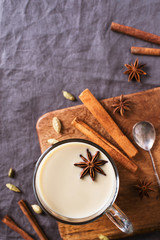 Fototapeta na wymiar Mug of spice latter tea or coffee, winter and autumn hot drink