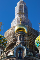 Orthodox domes under construction on a blue solid sky in Saint Petersburg, Russia