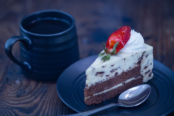 Coffee and chocolate and cheese cake on distressed wood background
