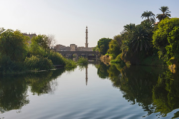 Landscape view of large river nile in Egypt with mosque