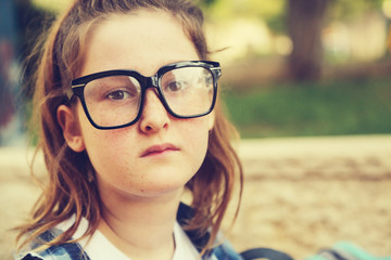 Portrait of tenage girl sitting outdoor