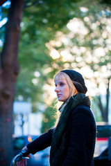 Fototapeta premium Caucasian female model poses for pictures on the street