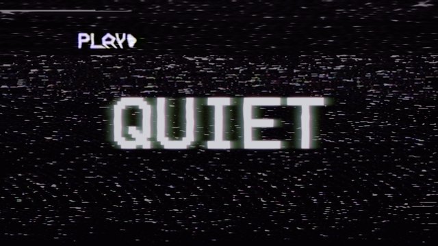 Fake VHS tape recording: the text Quiet, with RGB distortion, on a screen.
