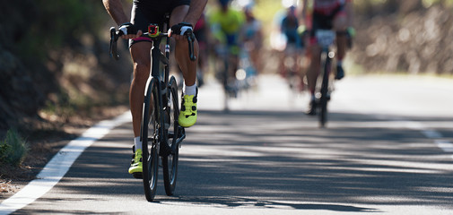 Naklejka na ściany i meble Cycling competition,cyclist athletes riding a race