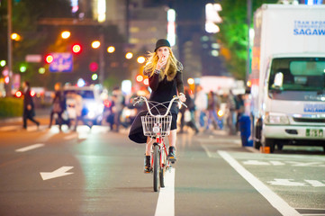 Caucasian female model poses for pictures on the street