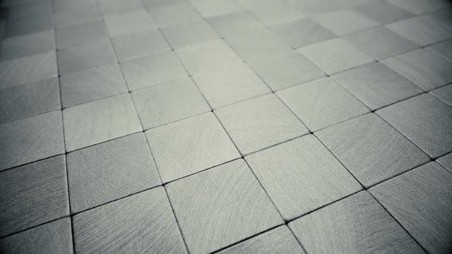 Metal surface consisting of square plates. Depth of field.