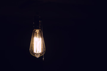 Lamps with tungsten filament. Edison's light bulb. Filament filament in vintage lamps. Retro design...