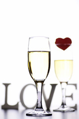 glass of white wine on a table on white background isolate