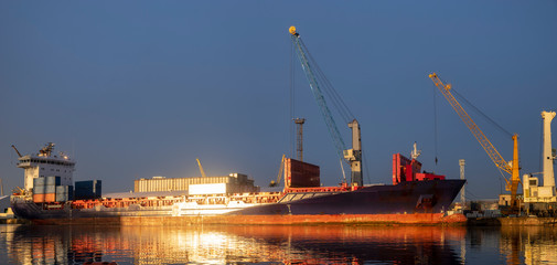 ship in the sea port,port cranes unloading containers-panorama