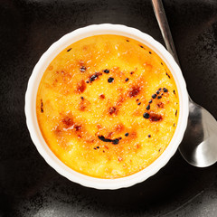 Creme brulee. Traditional French vanilla cream dessert with caramelised sugar on top . - Image