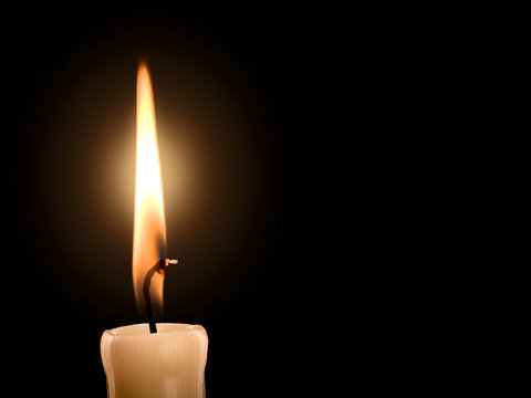 Flame of burning paraffin candle
