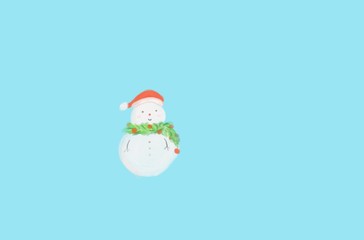Cute digital hand draw snowman was decorated with garland and Christmas hat