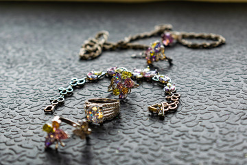 Silver jewelry with colored stones-cubic Zirconia of different colors, delicate shades. Jewelry pink, green, yellow and lilac. Rhinestones on metal products. Women's fashionable and stylish image.