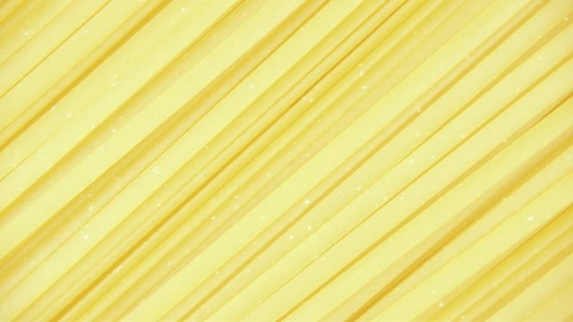 Background pasta Tagliatelle rotate clockwise top view
