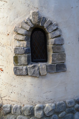A old window framed with brick stones