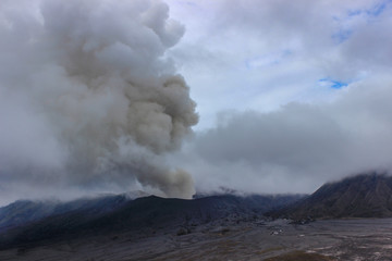 White smoke rises from the eruption of Mount Bromo, Indonesia
