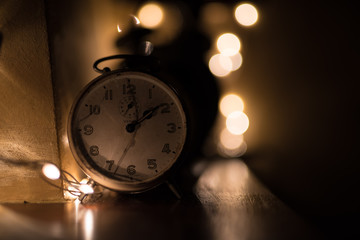 Fototapeta na wymiar old alarm clock on black background
