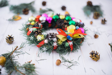 Christmas wreath with New Year's decor on a white wooden background