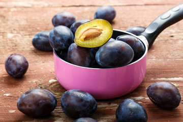ripe plums in a saucepan