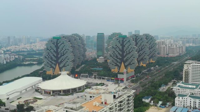 sanya cityscape famous hotel apartment complex riverside aerial panorama 4k hainan china
