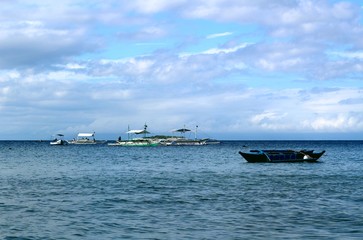 Boats in the sea in the Philippines waiting for tourists to travel around the islands