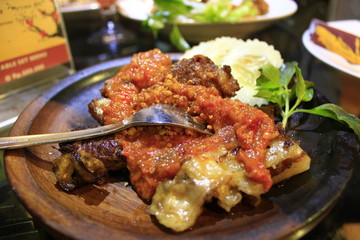 Grilled ribs with chili sauce, rice and vegetables