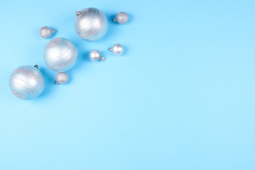 Christmas baubles on blue background.
