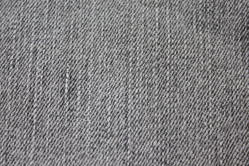 Fototapeta na wymiar Dark Grey Jeans Texture Background of Seamless Empty Fabric, Close Up Top View. Washed Out Gray Jean Fabric Backdrop, Empty Simple Canvas to Use as Copy Space, Template, Layout, Mock Up or Banner