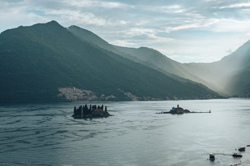 Islands in the Adriatic Sea after the rain against the backdrop of the mountains in Montenegro.