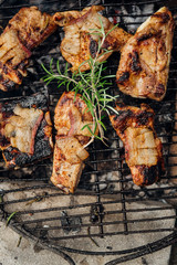 Pork ribs with rosemary on the grill from above