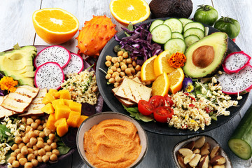grilled tofu and dragon fruit buddha bowl with vegetable and humus