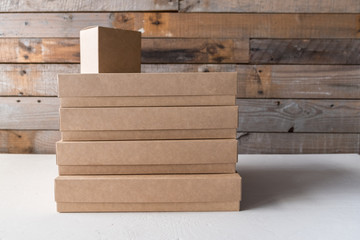 Set of gift cardboard boxes different sizes on wooden background