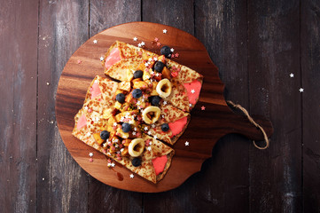 Delicious Tasty Homemade crepes or pancakes with apple, banana and blueberries.