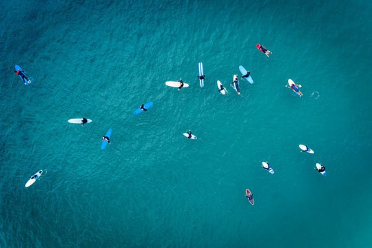 Aerial view of surfers in the ocean at the Baleal beach in Peniche, Portugal
