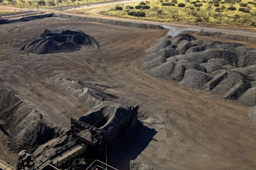 Large piles of processed Manganese ore rock