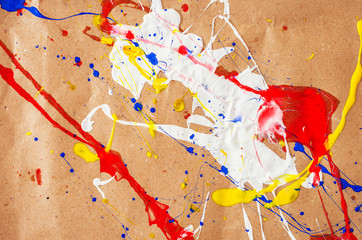 White and blue and yellow and red blemish on the paper