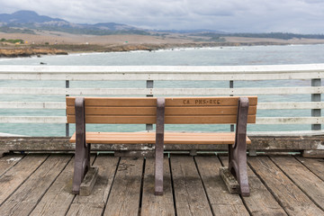 Fototapeta na wymiar A bench in the pier of San Simeon, California, USA