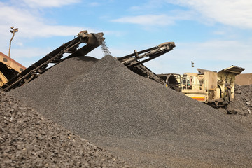 Large piles of processed Manganese ore rock