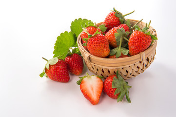 A bowl of beautiful strawberries isolated on white background with clipping path, close up, macro.