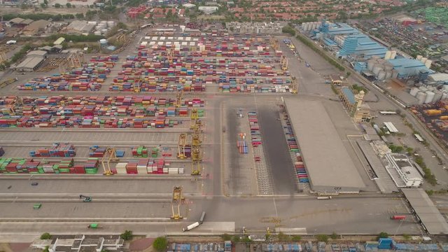 aerial view container terminal port surabaya. cargo industrial port with containers, crane. Tanjung Perak, indonesia. logistic import export and transport industry