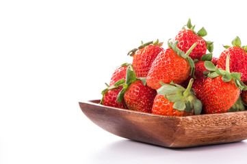 A bowl of beautiful strawberries isolated on white background with clipping path, close up, macro.