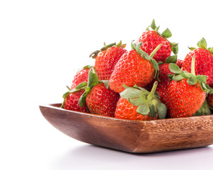 A bowl of beautiful strawberries isolated on white background with clipping path, close up, macro.